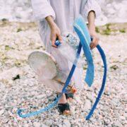 person holding plastic bottle