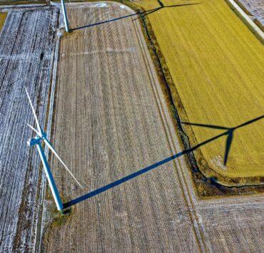 high angle photo of wind turbine on field