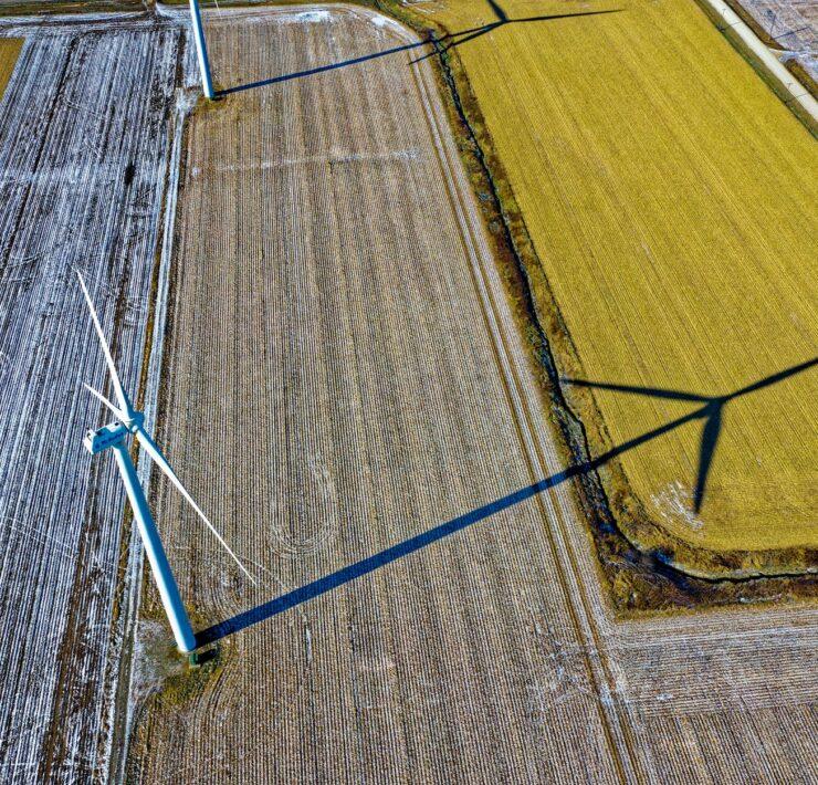 high angle photo of wind turbine on field