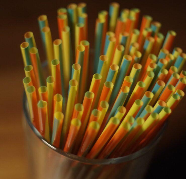 colorful plastic straw on a glass container