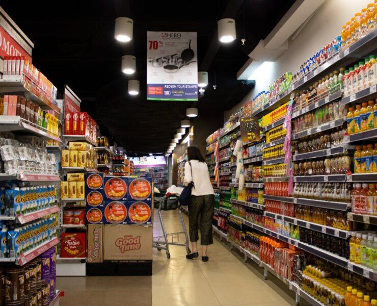 photo of woman pushing cart