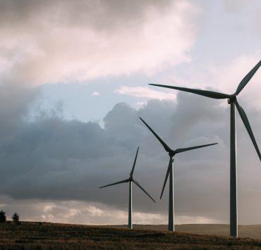 three gray wind turbine
