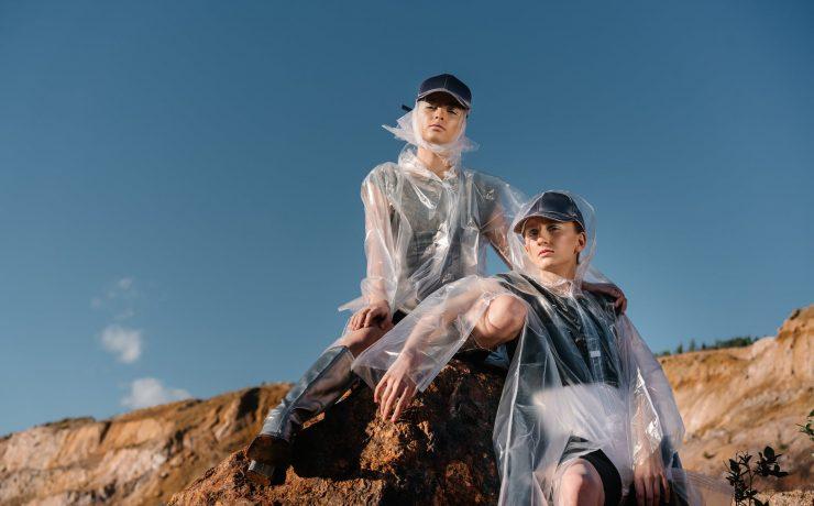 women wearing caps and transparent raincoats