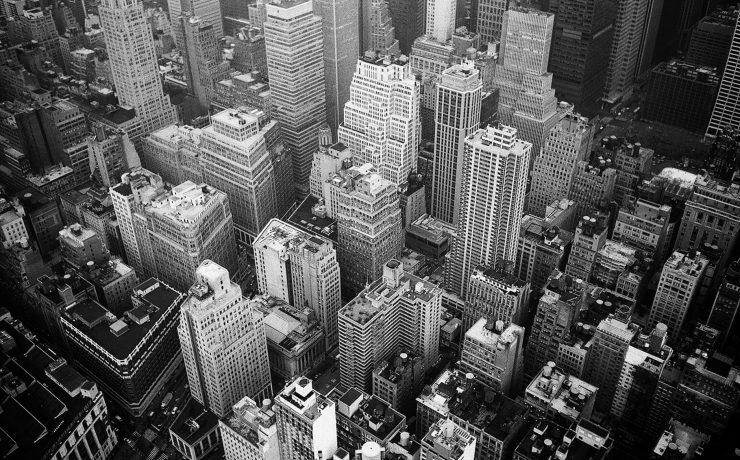 aerial view and grayscale photography of high rise buildings