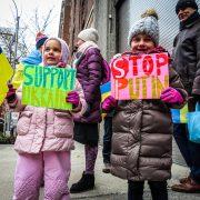girls with signs on protest against russian war on ukraine