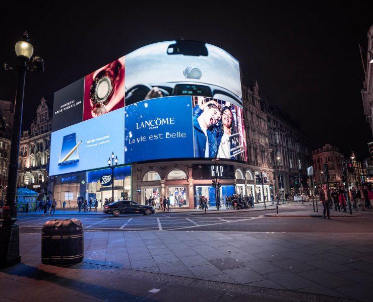 people walking near buildings during night time