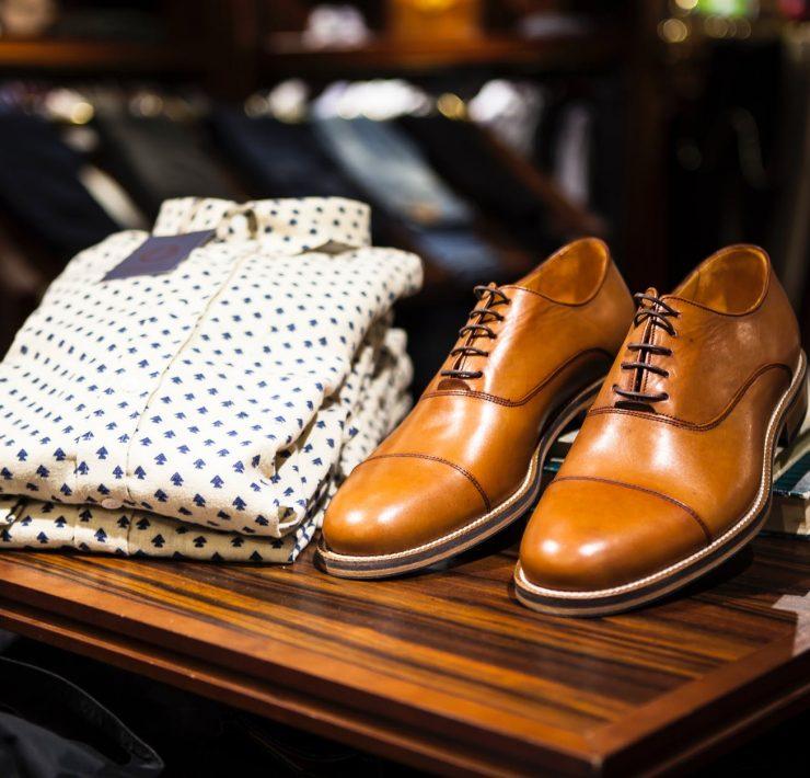 pair of brown leather casual shoes on table