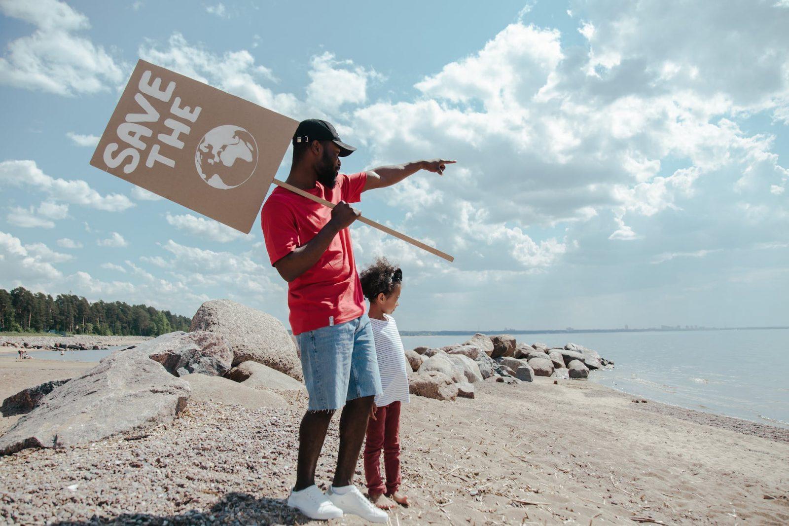 father and child standing on the beach