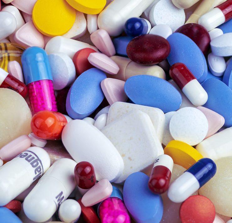 white blue and orange medication pill