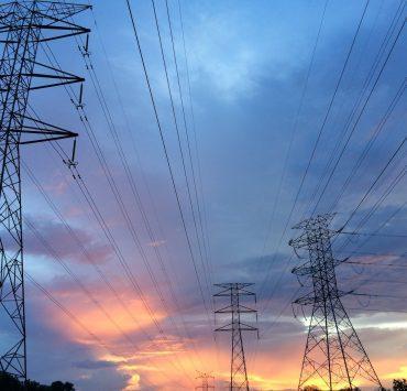 transmission tower under gray sky