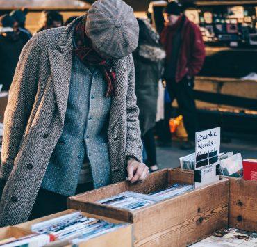 person standing in front of brown crate