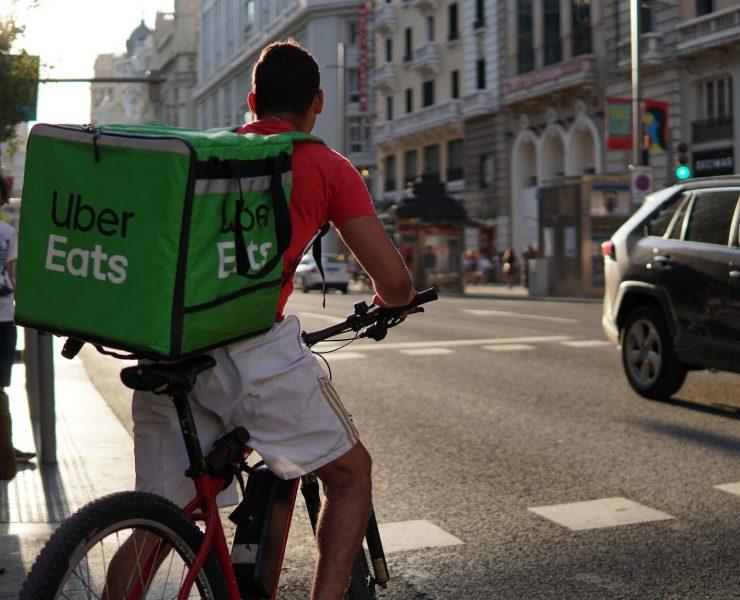 a delivery man riding a bike