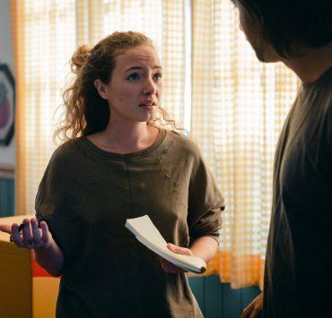 couple talking while moving in new apartment