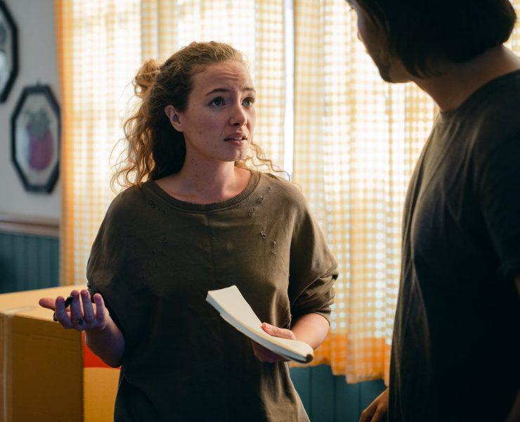 couple talking while moving in new apartment