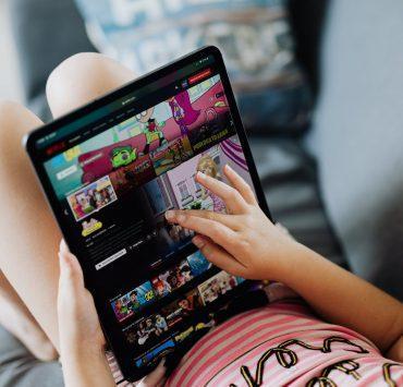 little girl holding a tablet