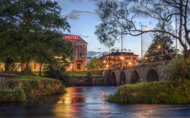 river near bridge beside hotel