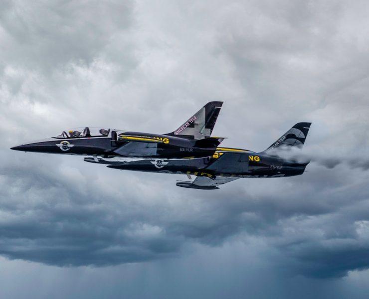 black fighter jet flying in the sky