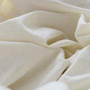 white textile in close up photography