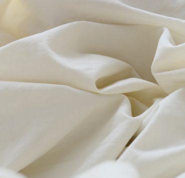 white textile in close up photography