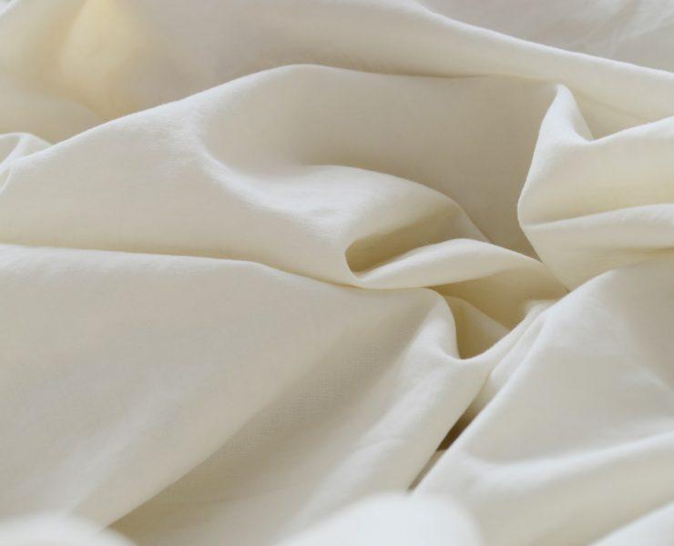white textile in close up photography