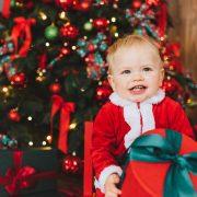 baby in red and white santa costume