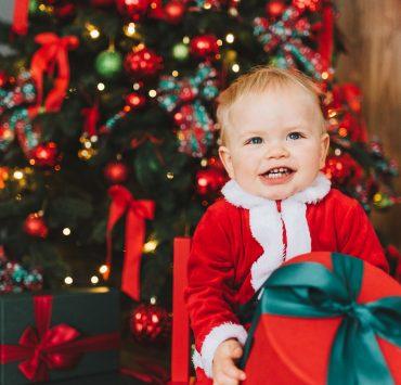 baby in red and white santa costume