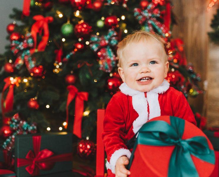 baby in red and white santa costume