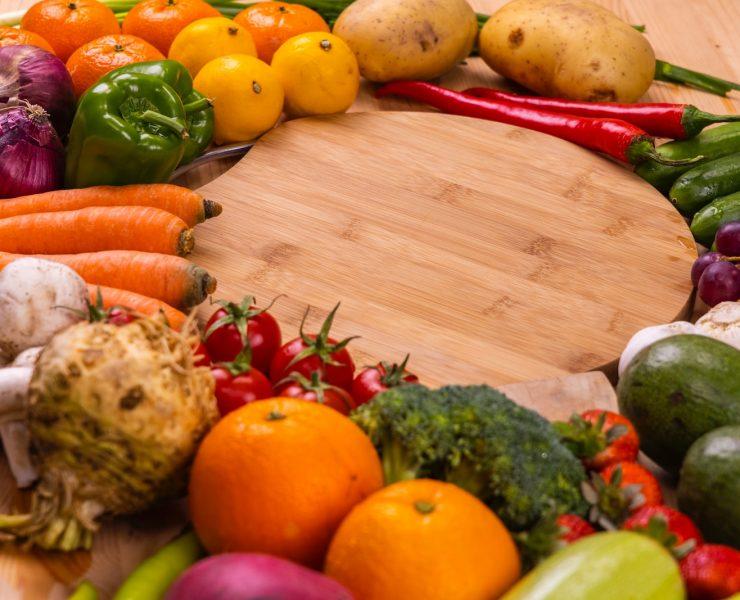 orange and green vegetables on brown wooden table