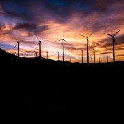 silhouette of windmills during golden hour