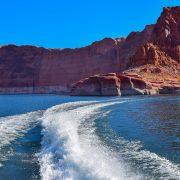 brown rocky mountain beside blue sea during daytime
