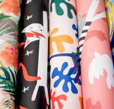 black white blue and pink floral textile