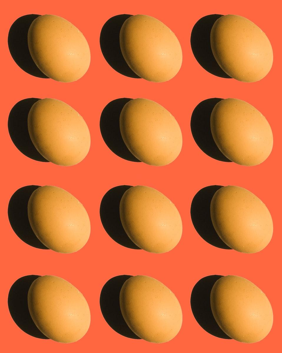 brown egg on orange background