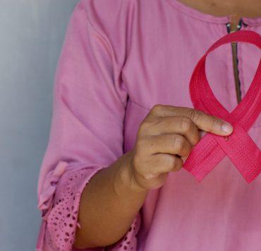woman in pink and white polka dot shirt