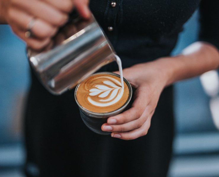 person holding coffee with latte cup