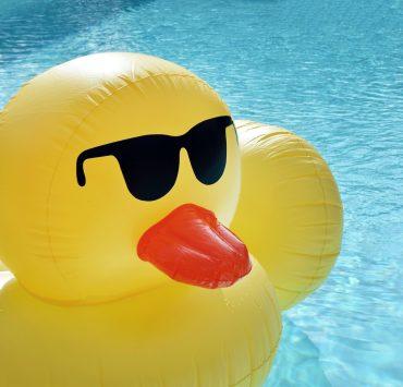 yellow inflatable balloon floating on water