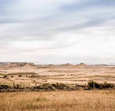 green grass field near mountains