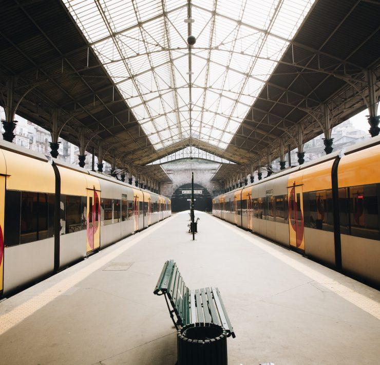 green metal train station bench