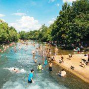 group of people in body of water during daytime