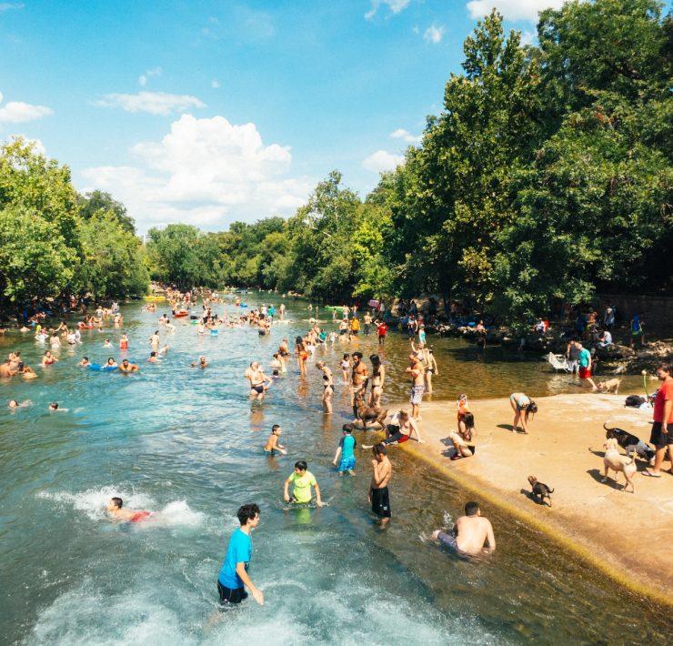 group of people in body of water during daytime