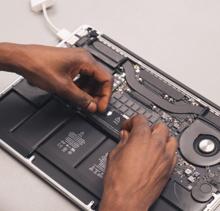 a person holding a laptop