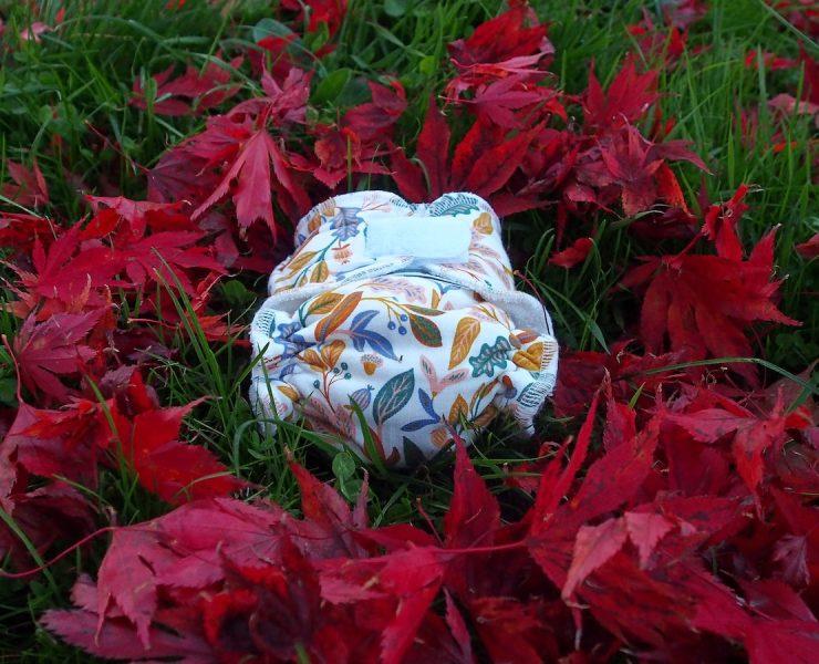 a plastic container in a field of red flowers