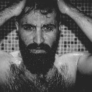 topless man with black face paint