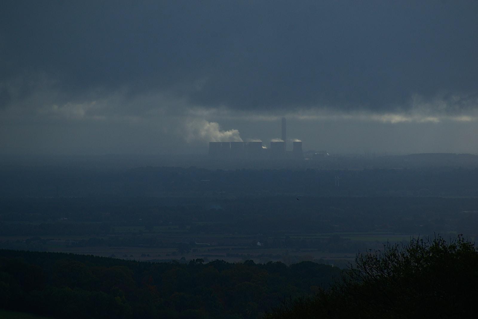 aerial photography of buildings viewing mountain under blue and gray sky