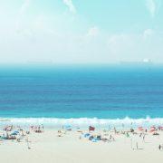 group of people on white sand beach