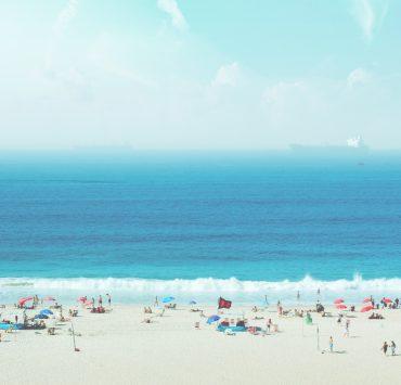group of people on white sand beach