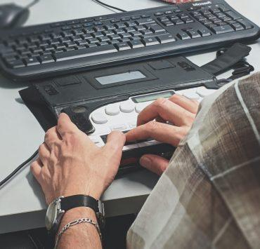 person holding black plastic case
