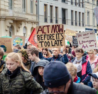 people walking near white concrete building