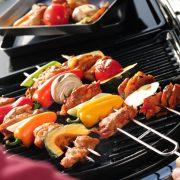 a person is grilling food on a grill