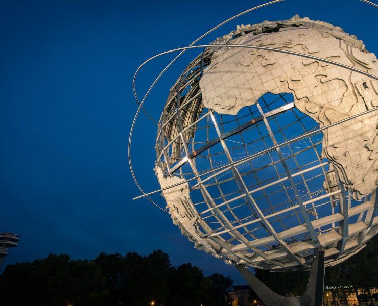 low angle photo of Earth metal statue