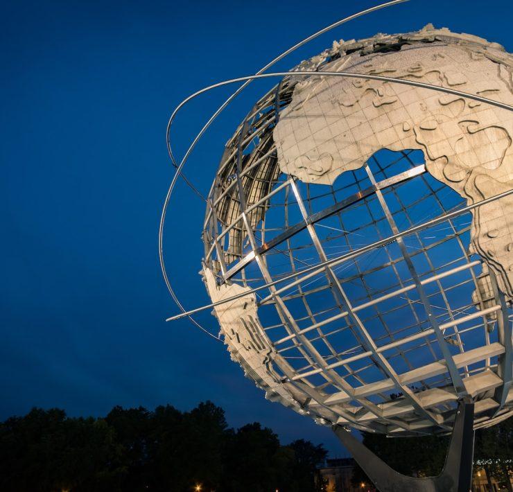 low angle photo of Earth metal statue